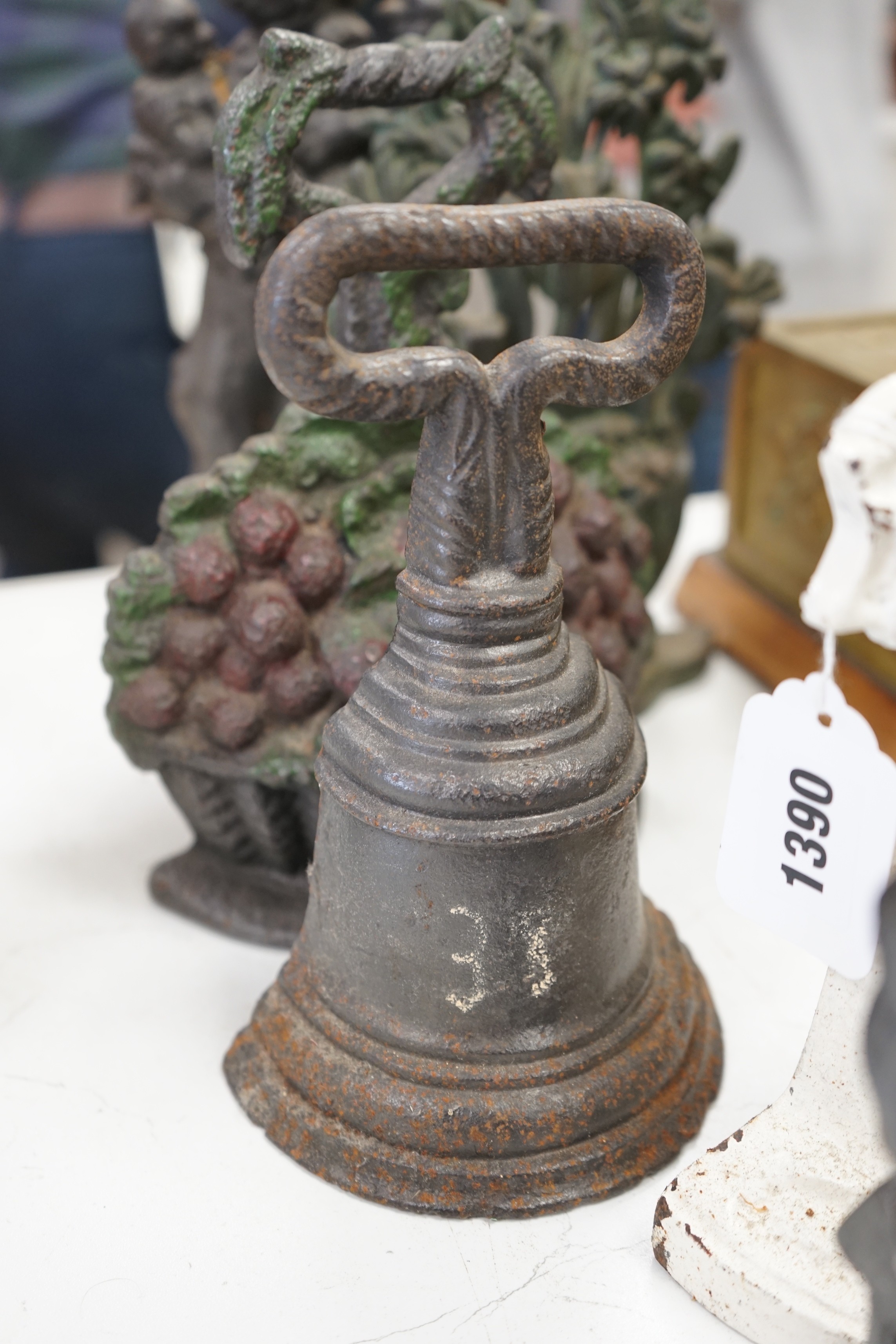 Six assorted Victorian cast iron door stops, some later painted, 27cm tall